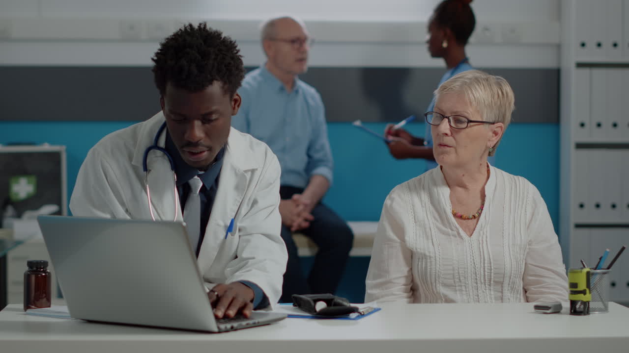 Doctor examining patient's ear