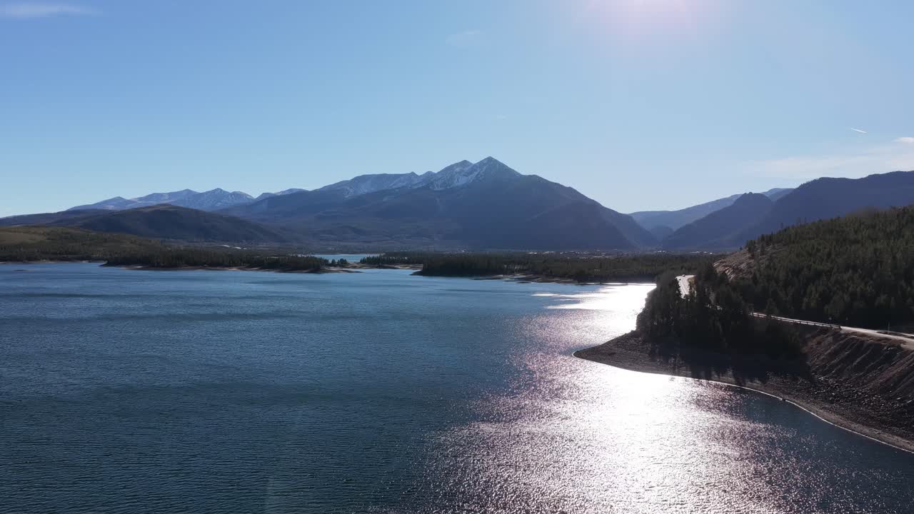 Ascending drone shot over Dillon Reservoir looking at Frisco, Colorado in the Rocky Mountains