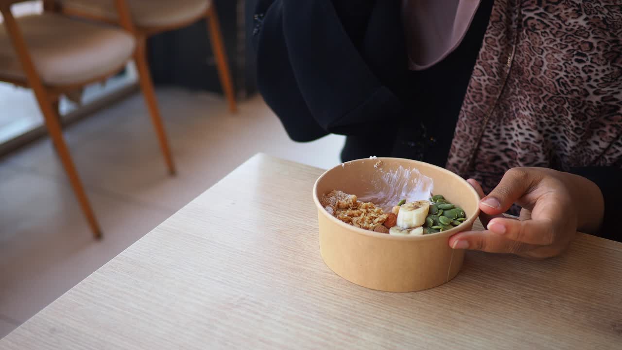 Bowl of food being eaten at a table