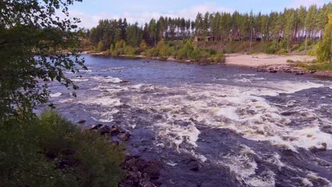 Pan-shote-of-milky-blue-glacial-water-of-Glomma-river-in-Norway