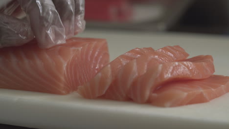 Macro-Close-Up-Shot-of-Salmon-being-Sliced-and-Filleting-in-preparation-for-Sushi