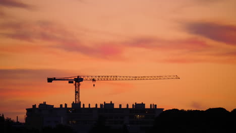 construction cranes at sunset montpellier buildings france orange sky france