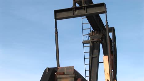 closeup of an oil pump turning in the new mexico desert 1