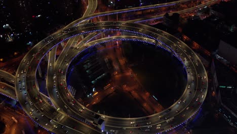 aerial video scene of traffic on nanpu bridge spiral road night sunset time with transportation on land concept, shanghai, china in 4k video