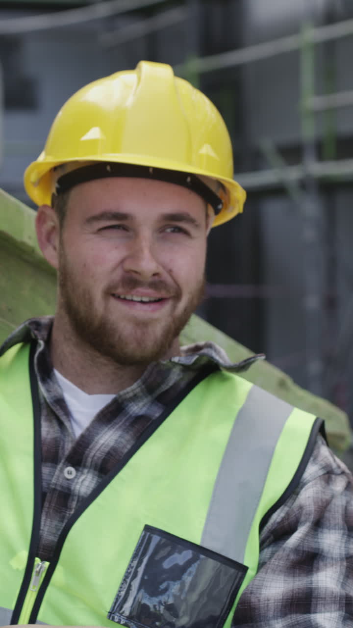 Happy Construction Worker with Hard Hat and Wooden Beam