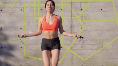 young athletic woman skipping outdoors slow motion medium shot