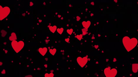 animación de iconos de corazones rojos flotando sobre un fondo negro