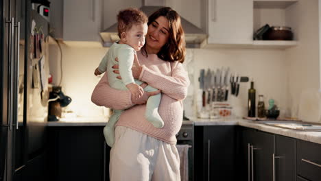 mother and baby in kitchen