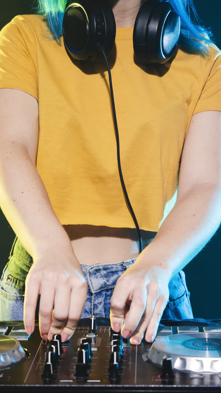 Vibrant DJ Performance with Blue Hair and Headphones