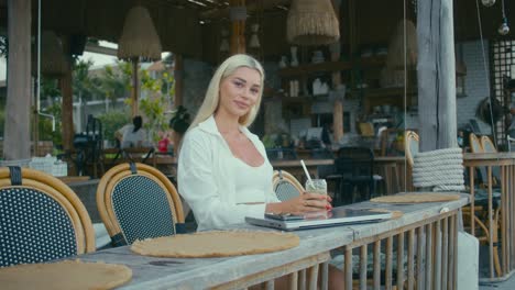 woman working at beachside cafe