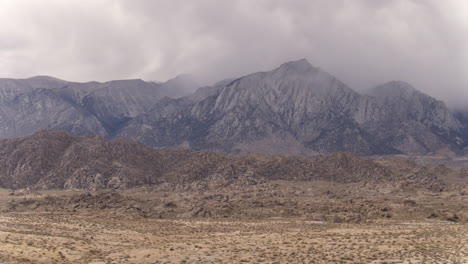 wide aerial drone flying along the alabama hills of california's sierra nevada mountain range