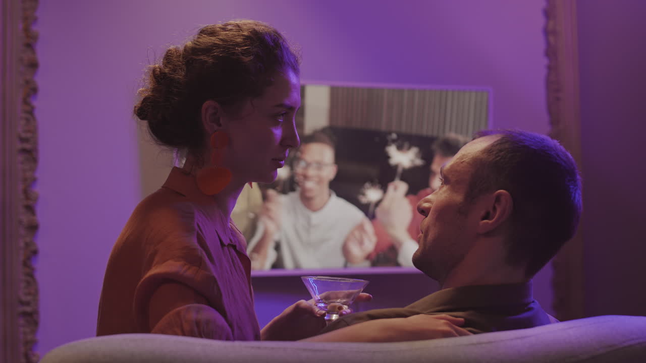 Affectionate Couple Flirting during Online Party with Friends