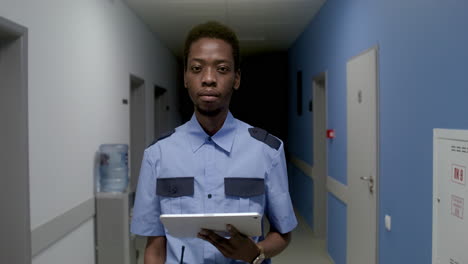 man in uniform posing on the corridor