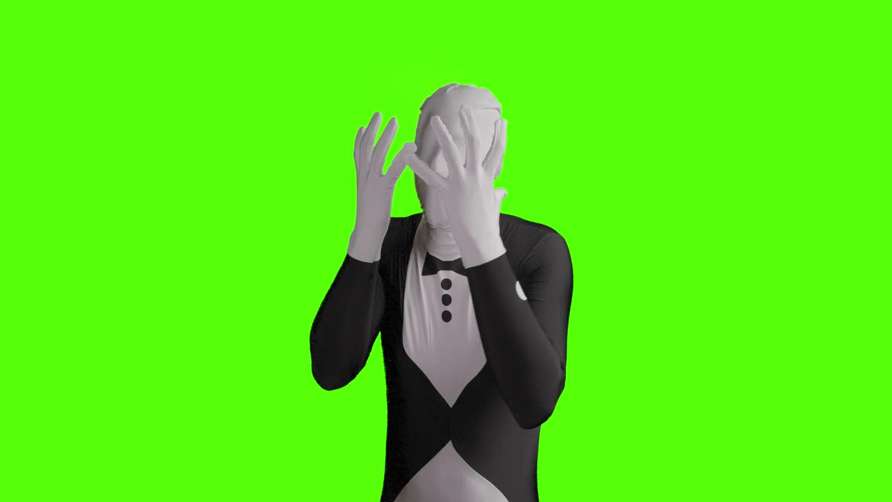 Cảnh tĩnh người mặc bộ đồ morphsuit doanh nhân giận dữ trở nên tuyệt vọng và chán nản trong khi khoa tay múa chân trên nền xanh lá