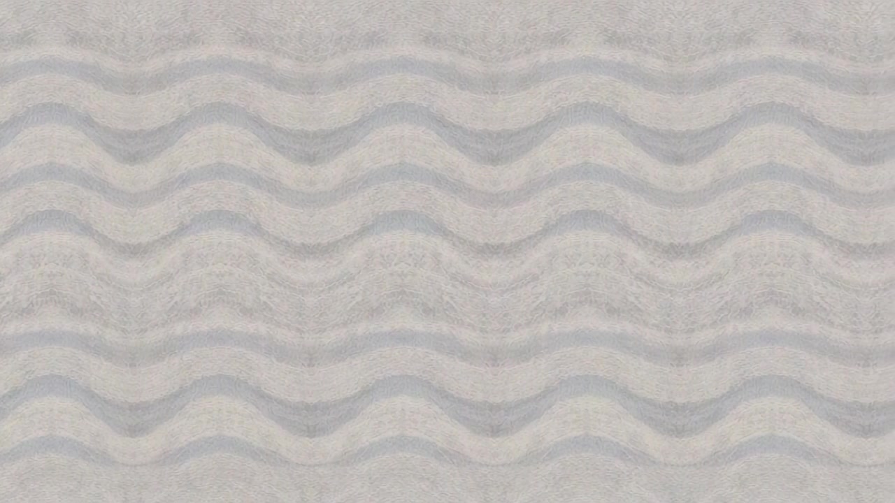 Opening frame showing textured panel occupying frame close-up on interior wall, with wavy bands