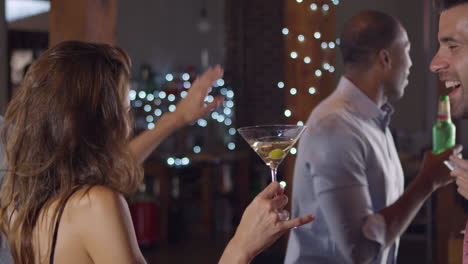 young adult friends dancing at a party make a toast, shot on r3d