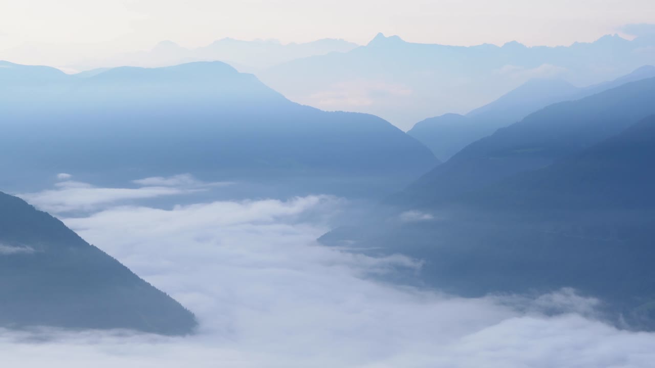 Looking down foggy Sterzing valley after sunrise