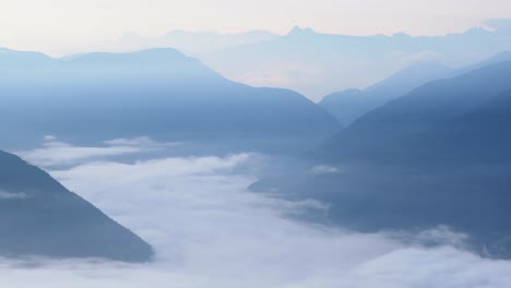 looking down foggy sterzing valley after sunrise