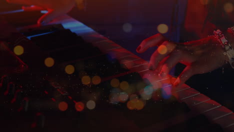 animation on blurred night road traffic over hands of biracial woman playing keyboard