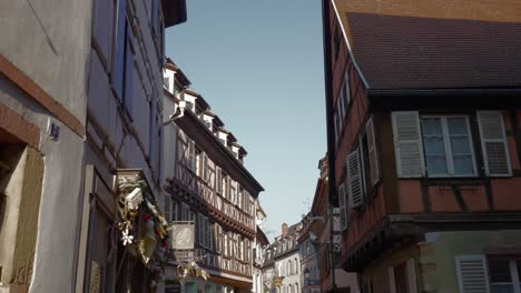 beautiful half timbered buildings in medieval town in france, small street view colmar