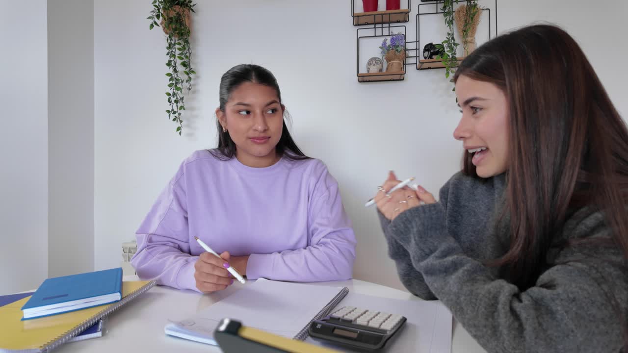 Two students studying at a table