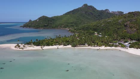 Aerial-rotates-to-reveal-small-tropical-island-Maupiti-in-Polynesia