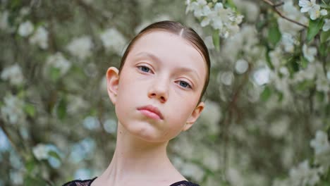 young girl in a spring garden