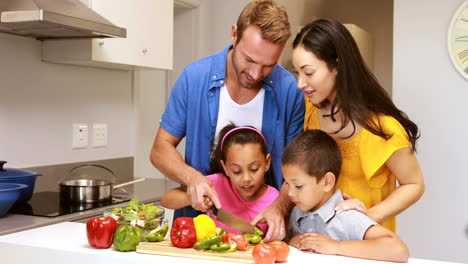 happy family preparing vegetables