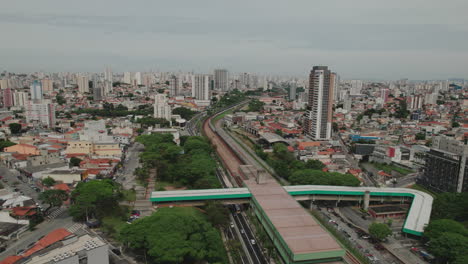 aerial view of metro station in vila guilhermina, são paulo. urban life, diverse architecture, and bustling streets.