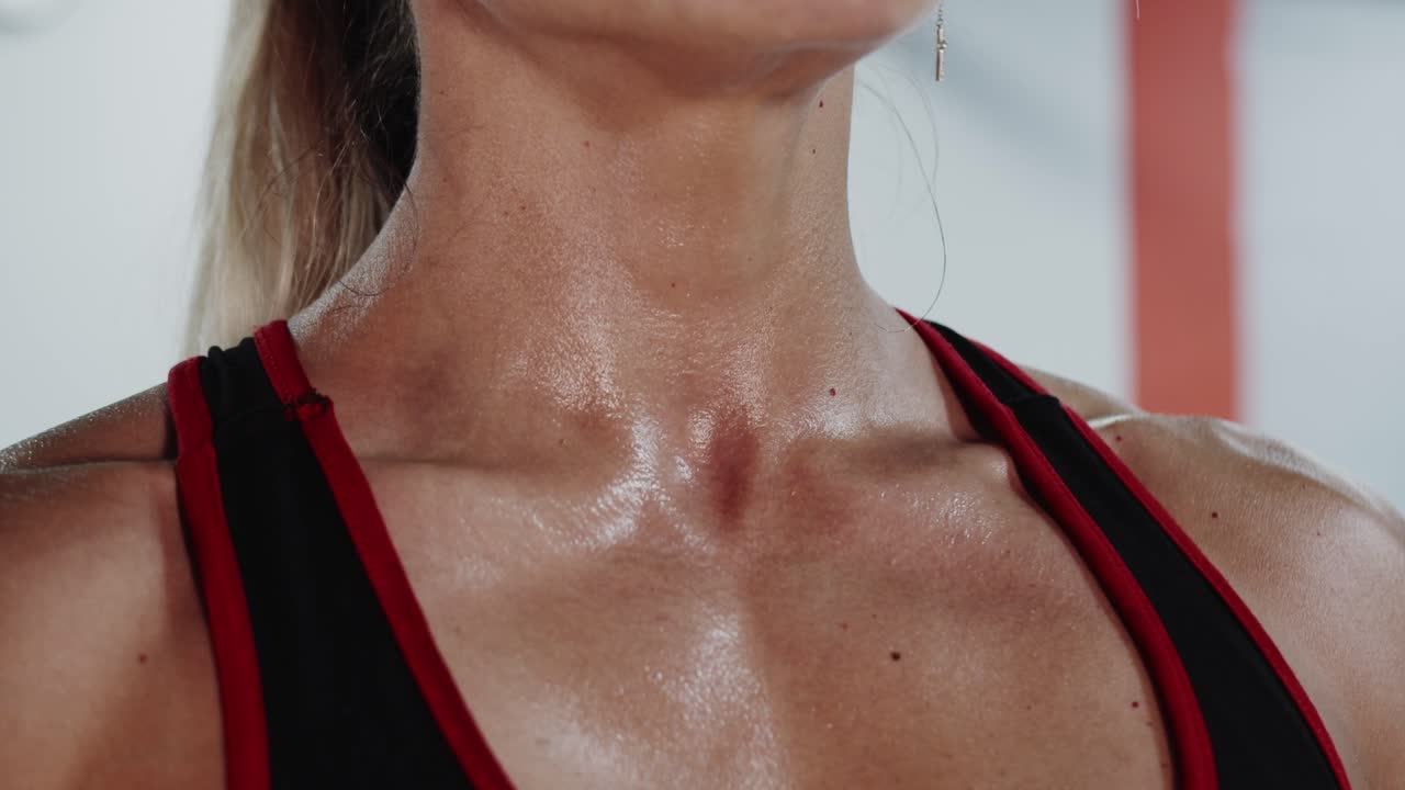 Woman's sweaty chest and neck after a workout