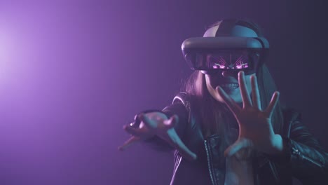 Anonymous-woman-in-VR-goggles-in-neon-light