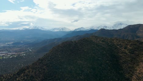 Aerial-view-truck-right-parallax-effect-at-Morro-Las-Papas,-San-Carlos-de-Apoquindo-Park