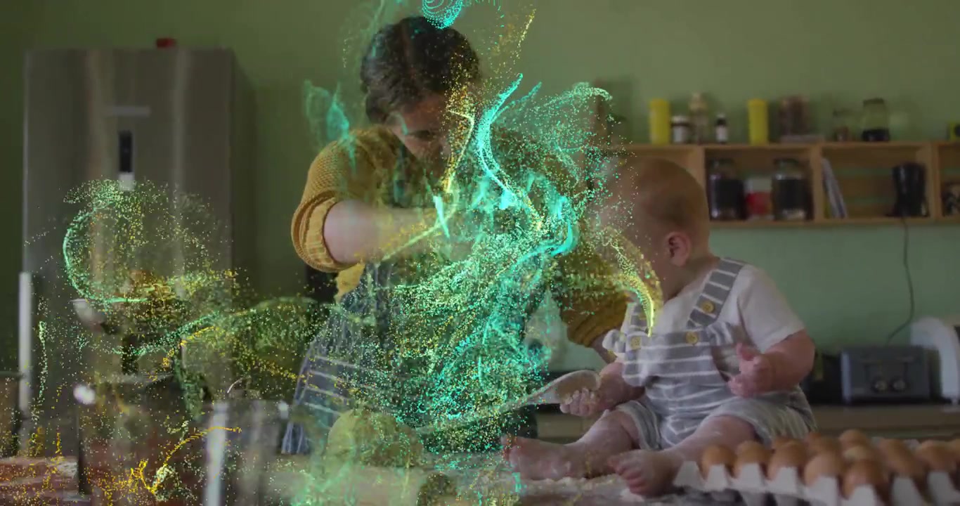 Mère faisant de la pâtisserie avec son bébé dans la cuisine avec des effets de particules numériques