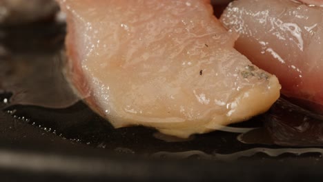 frying fish fillets in a pan