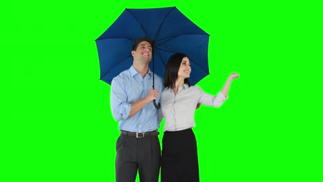 business people standing under umbrella