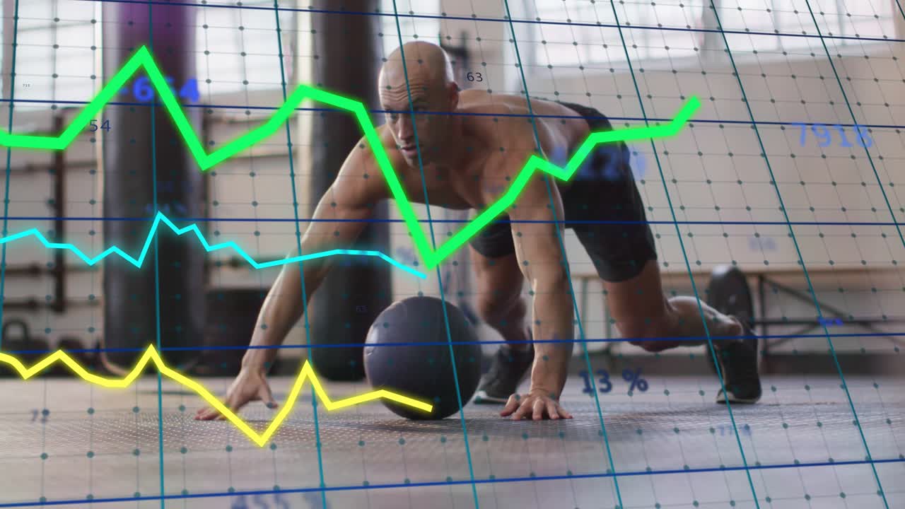 Man lowering into pushup on ball in fitness reaching while graphs moving in sync building strength