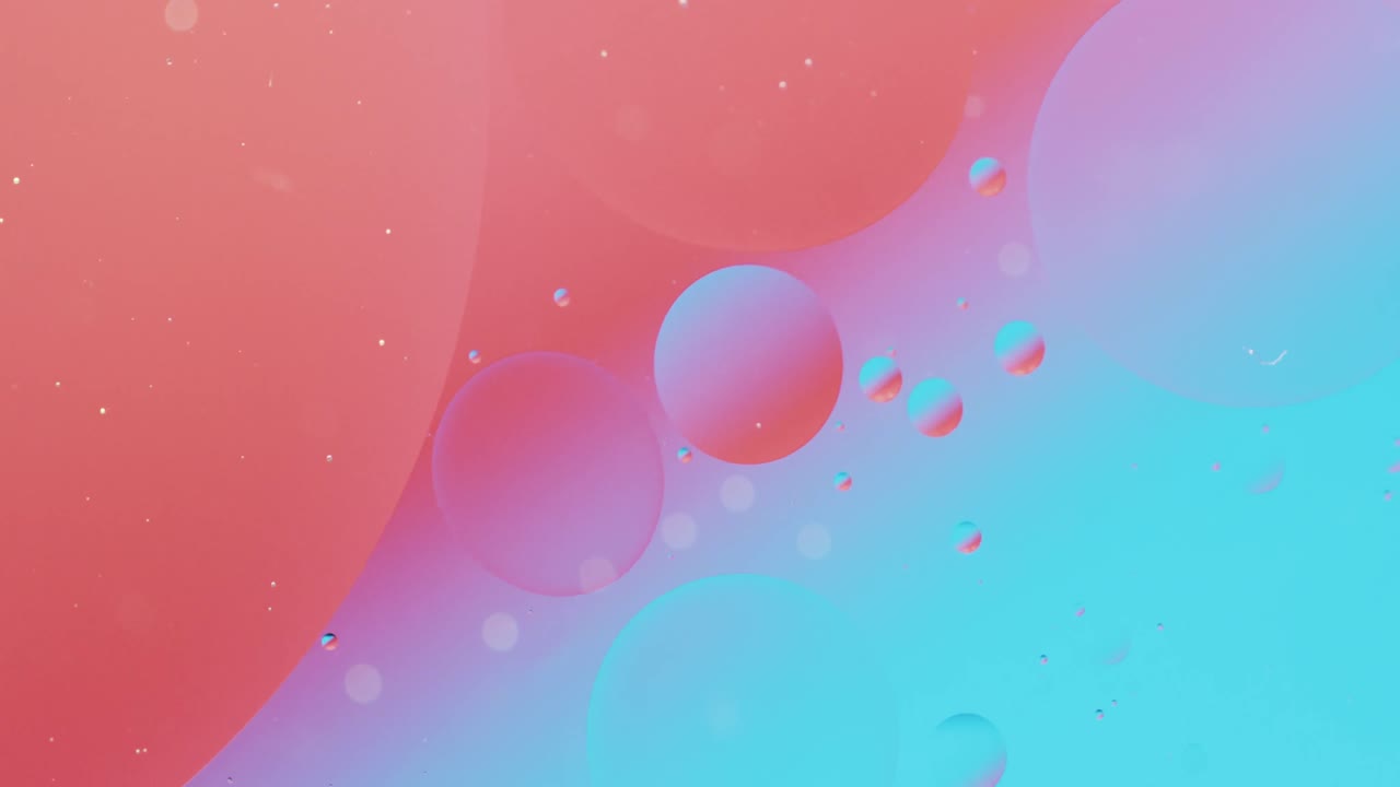 Animation of bubbles moving on red and blue background with copy space