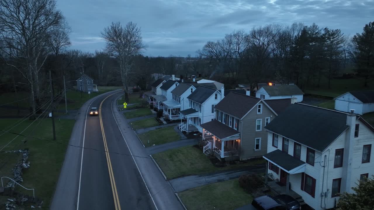 White car on Main Street in noble American neighborhood