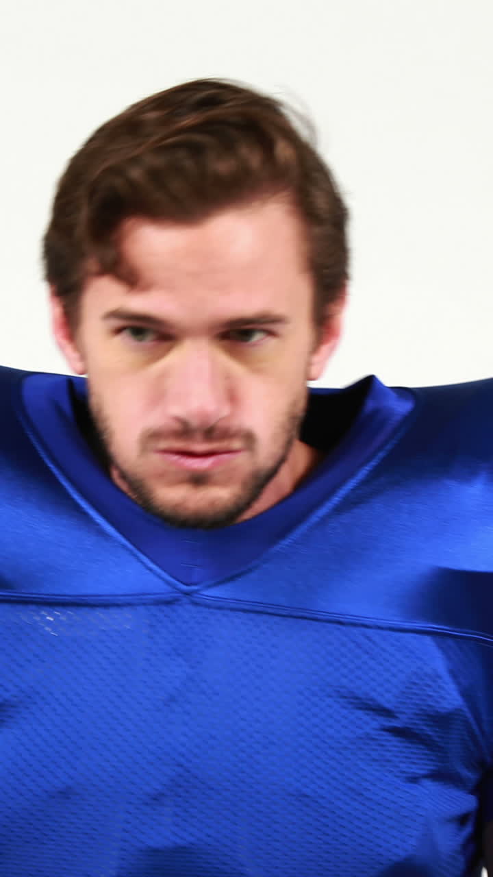 American football player holding ball