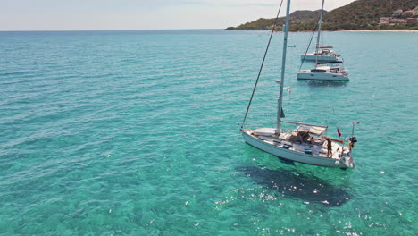 aerial tourists on boats at tropical sardinia sea