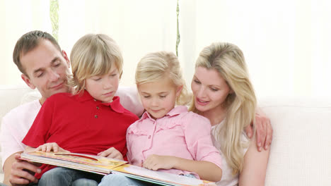 Happy-family-reading-on-the-sofa