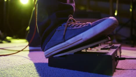 musician using a pedal point in a music studio