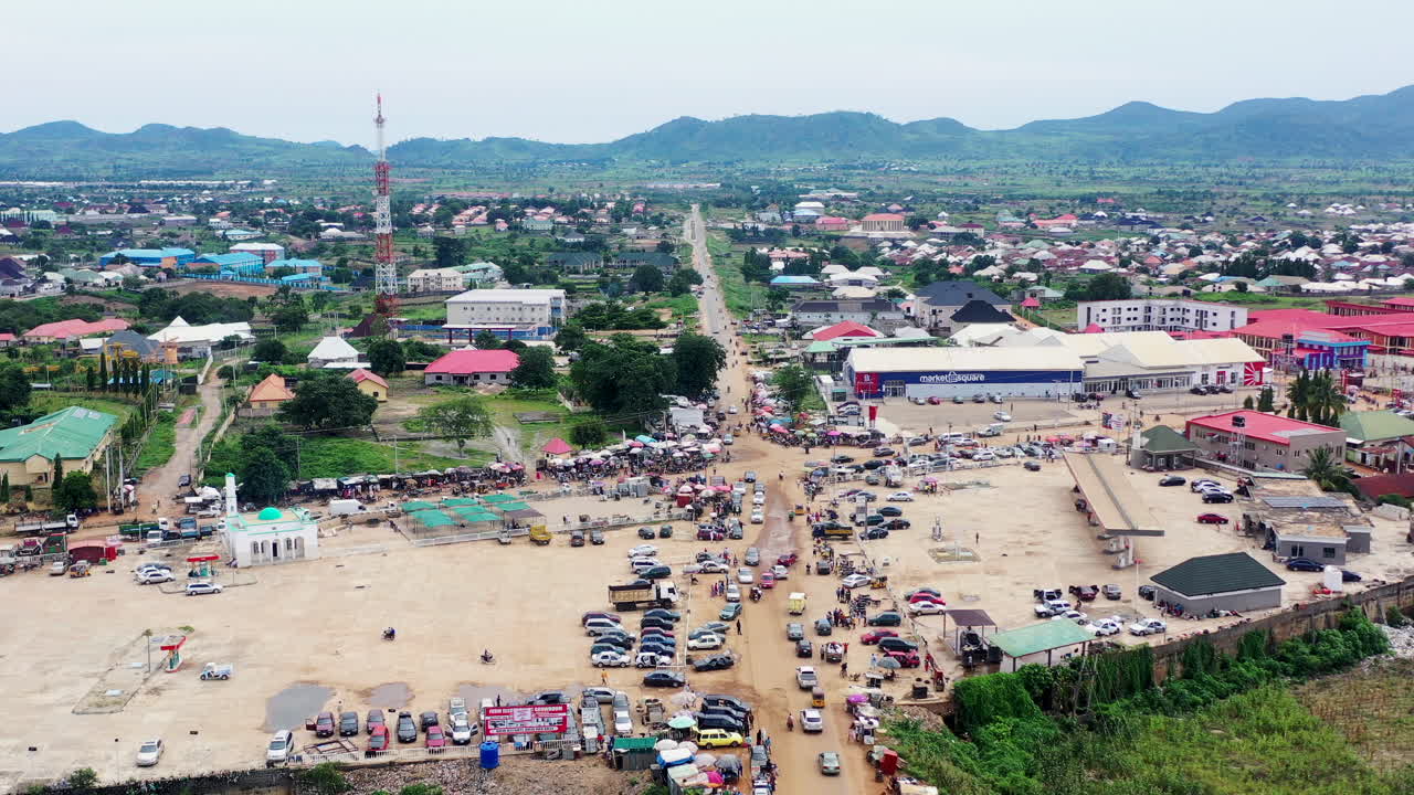 Kuje Area Council Highway in Nigeria's Federal Capital Territory - pullback reveal of a crowded town