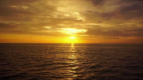 tropical sunset cruise, panning sunset over the ocean, malaysia