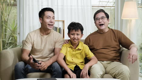 asian men and boy in the living room