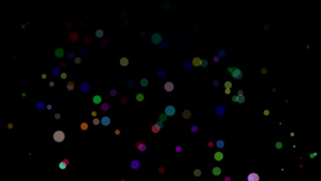 abstracto volando partículas coloridas aisladas en fondo negro. bokeh dinámico brillante en cámara lenta. animación de bucle digital 3d.