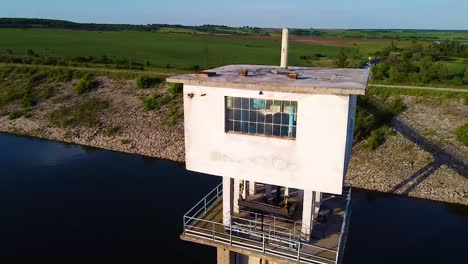 flying over dam with an old abandoned station