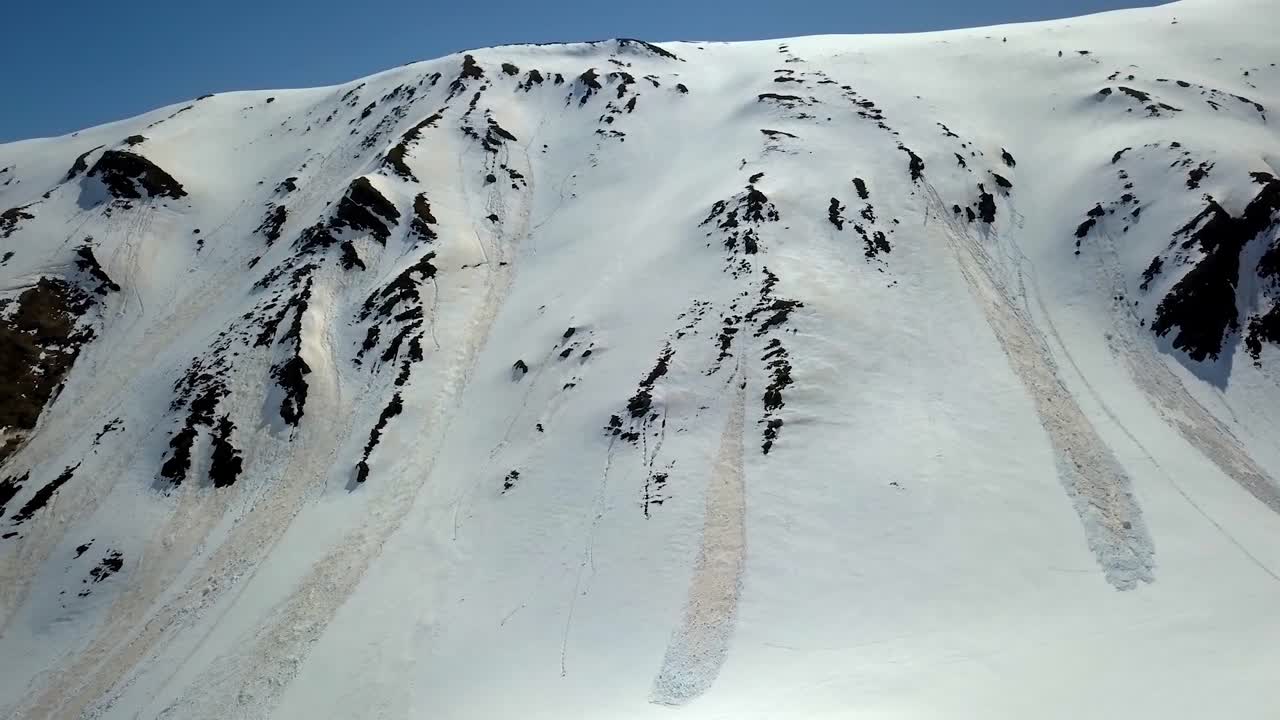 Aerial images of avalanches in the mountains of the French Pyrenees. Avalanche ferns during spring. Recording with a full HD pro mavic.