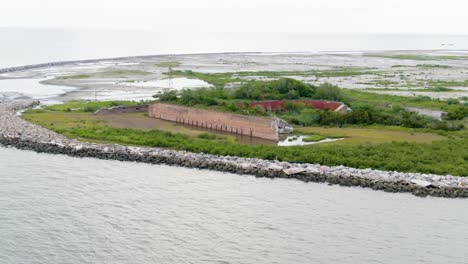 aerial medium shot of fort livingston on isle grand terre in grand isle, louisiana