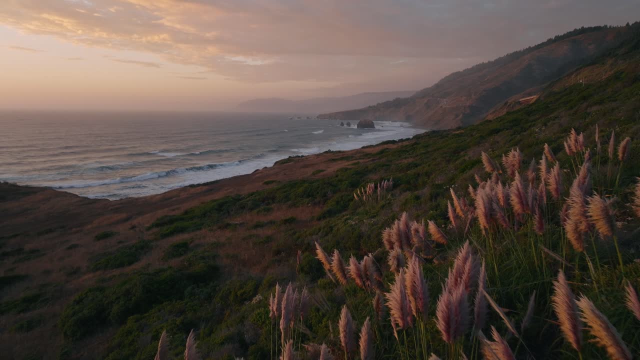 Serene California coast at sunset, peaceful ocean view in warm light